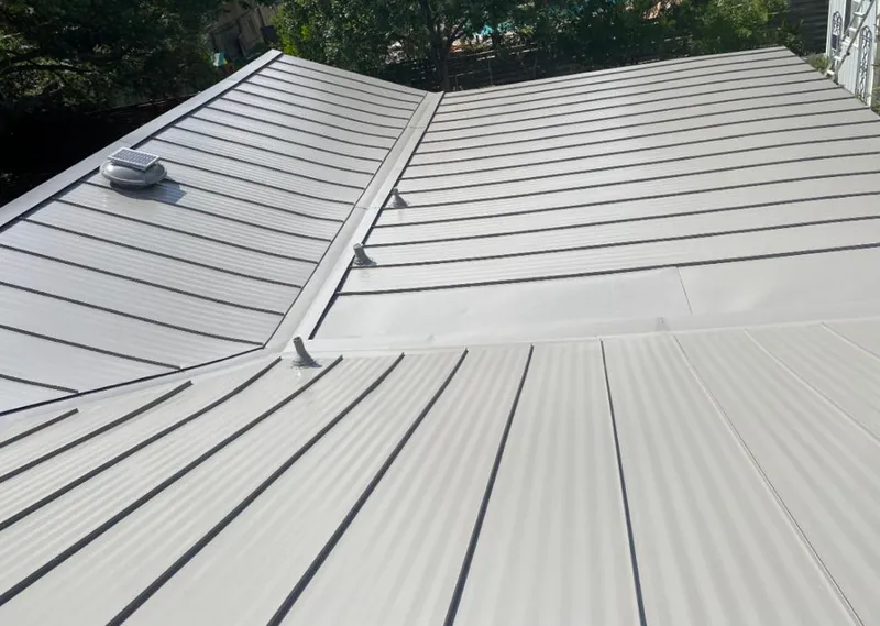 Solar attic fan installed on a metal roof for Roof Ventilation in Ormond Beach